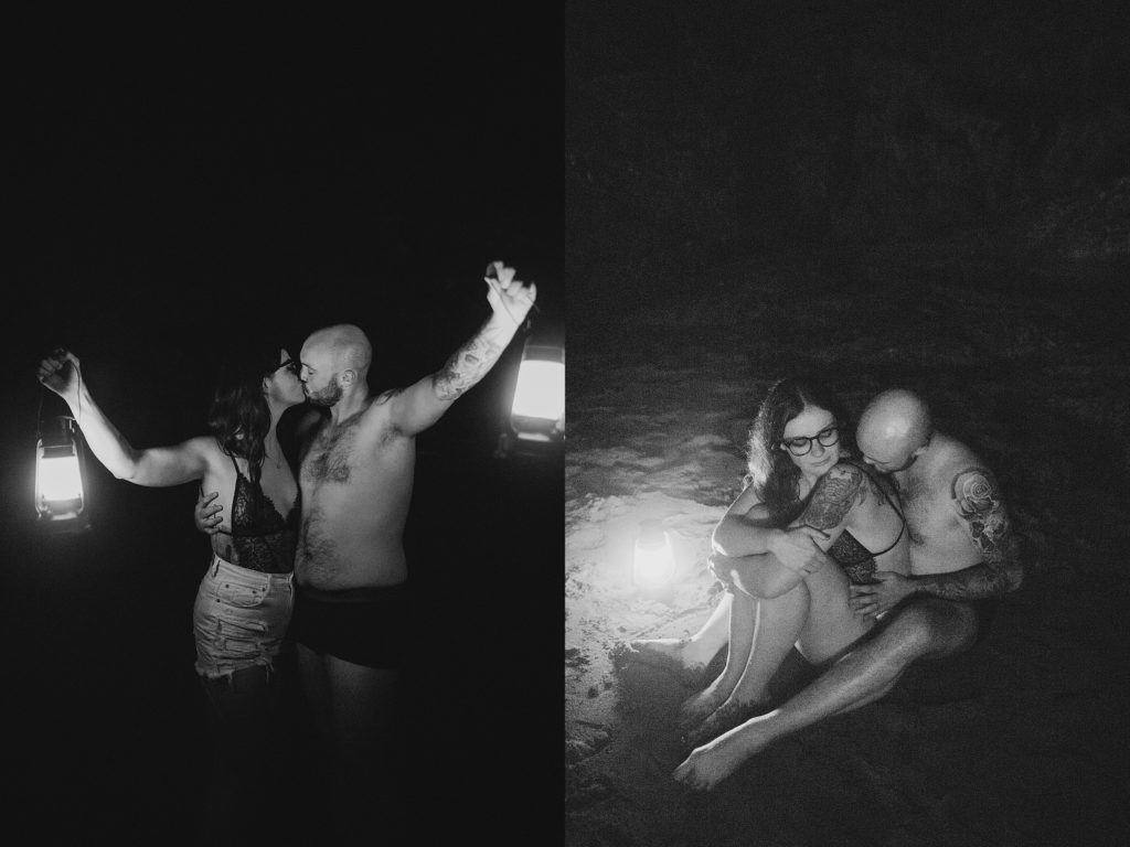 couple sitting on beach in the dark