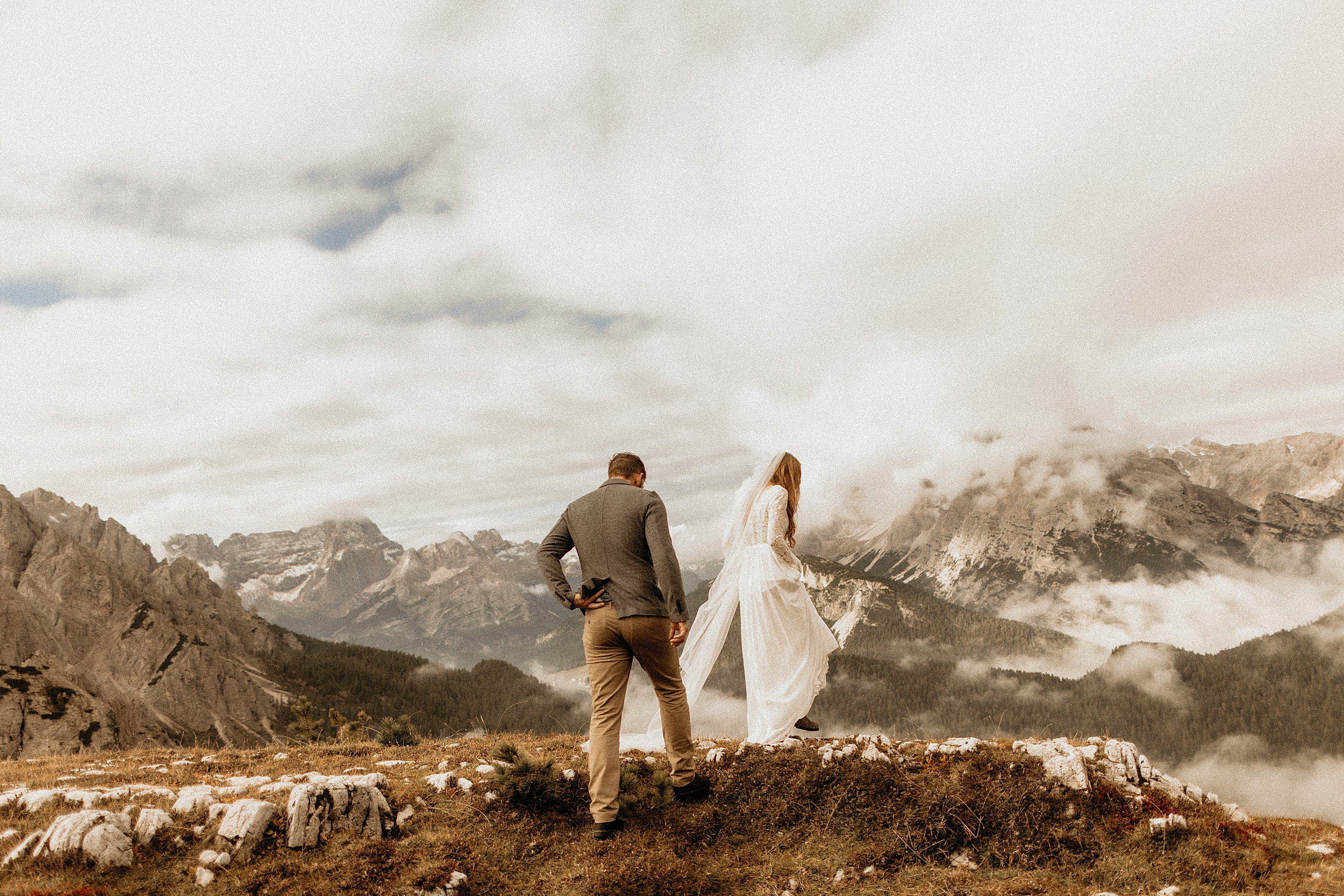 bride and groom standing together dolomites landscape
