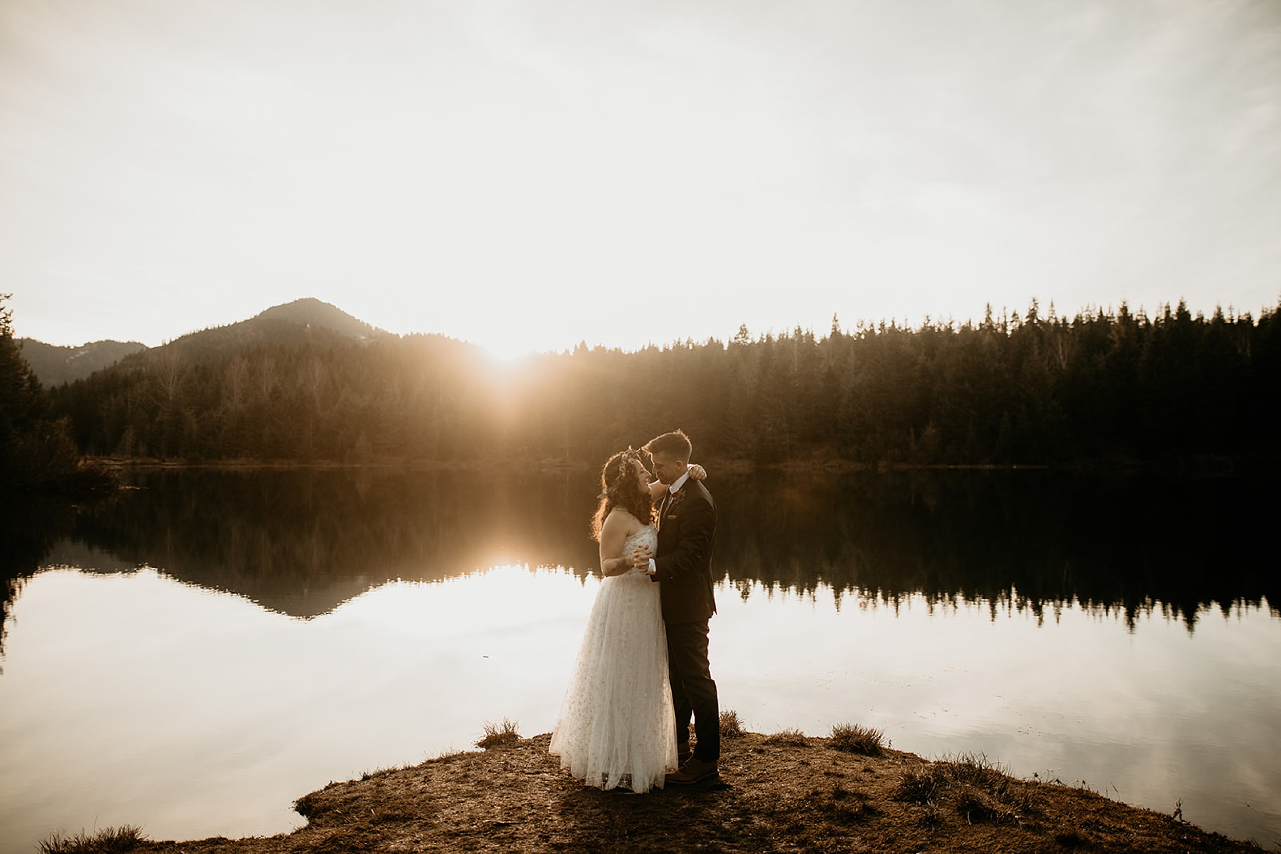 bride and groom holding hands gold creek pond