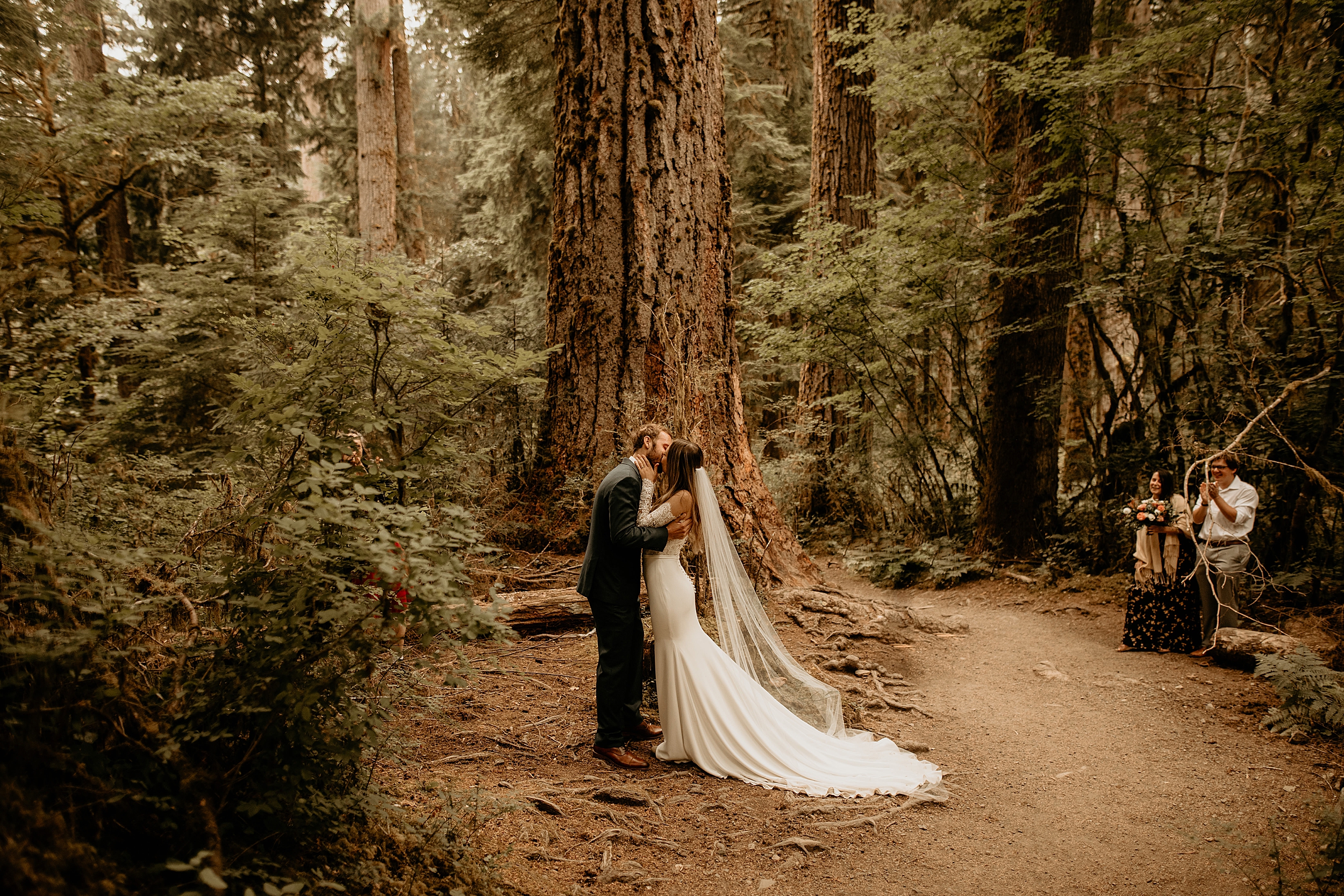 bride and groom kissing mt. hood national forest


