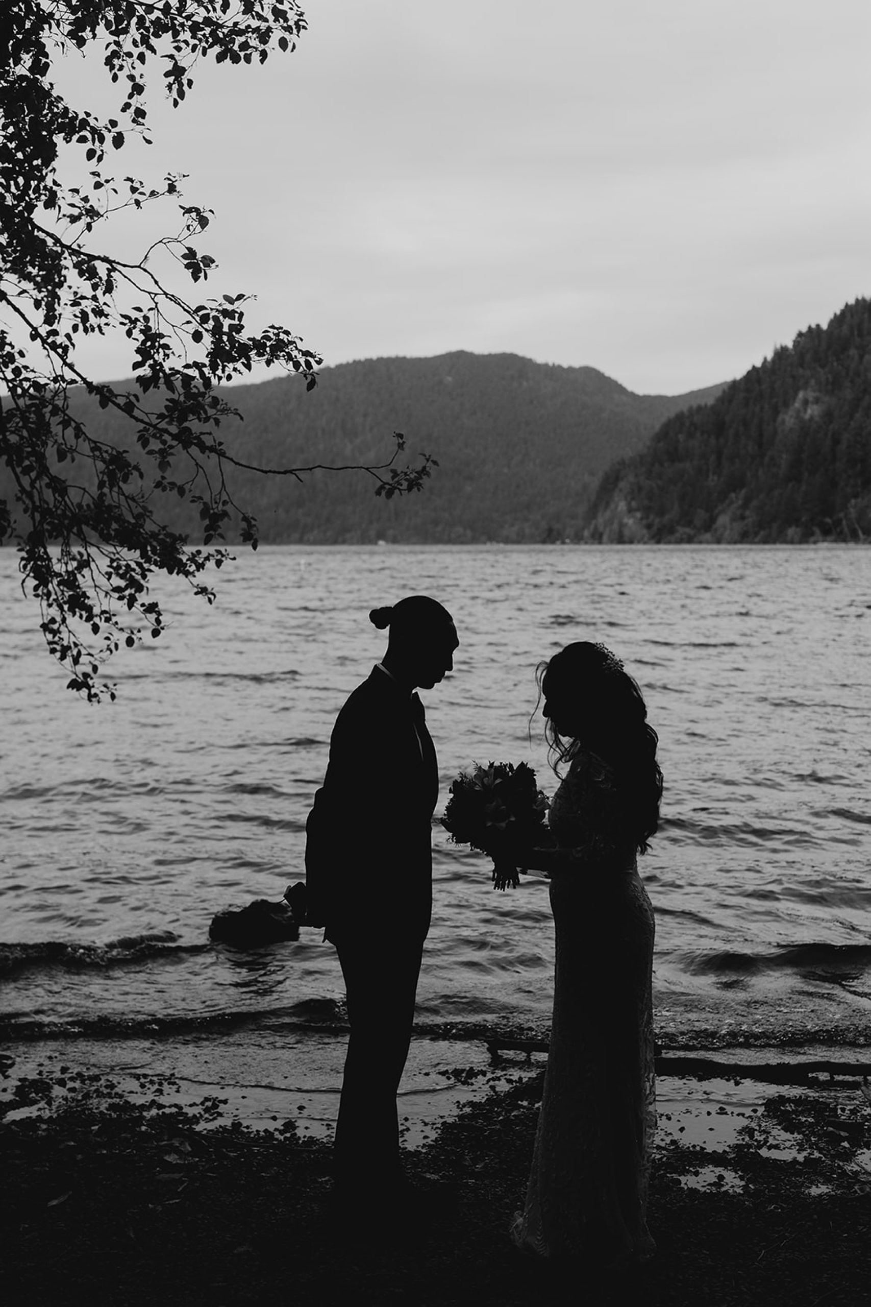 bride and groom standing together lake crescent landscape 

