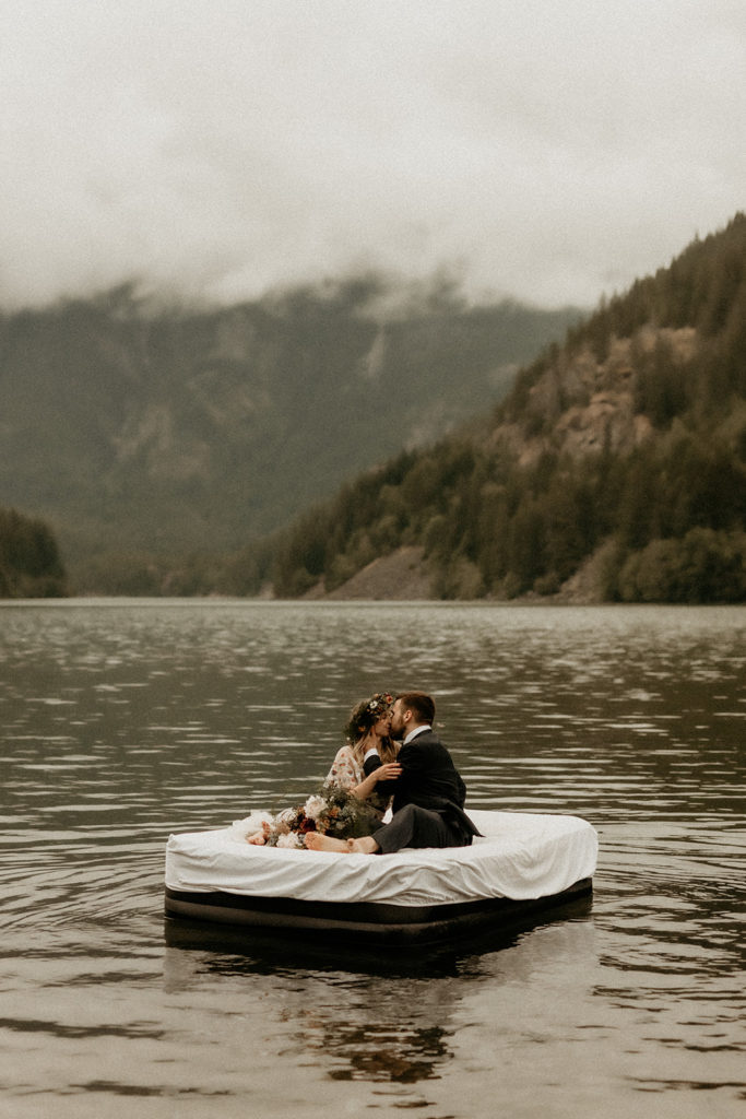 couple floating on diablo lake on their elopement day
