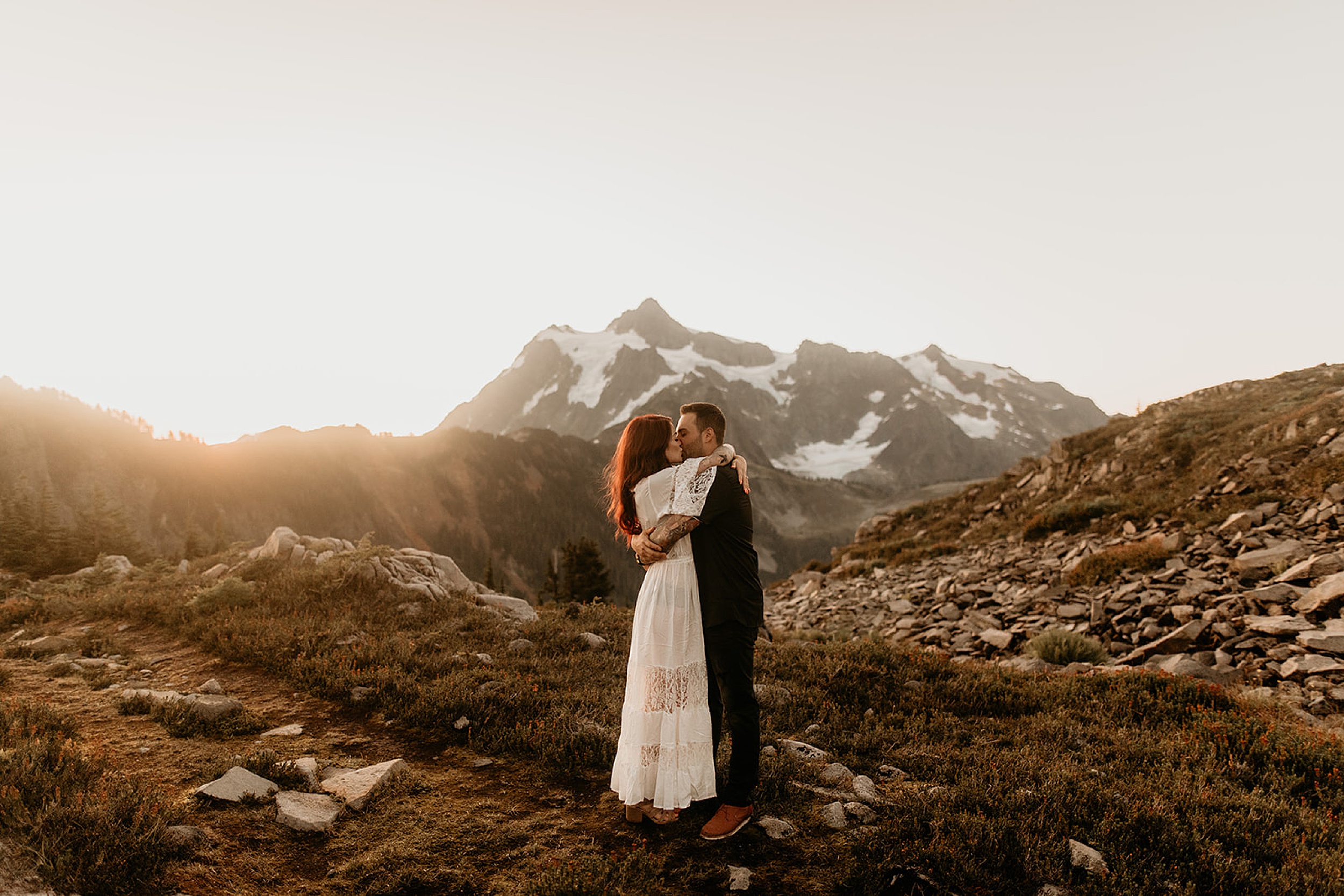 bride and groom holding each other mountain hill landscape