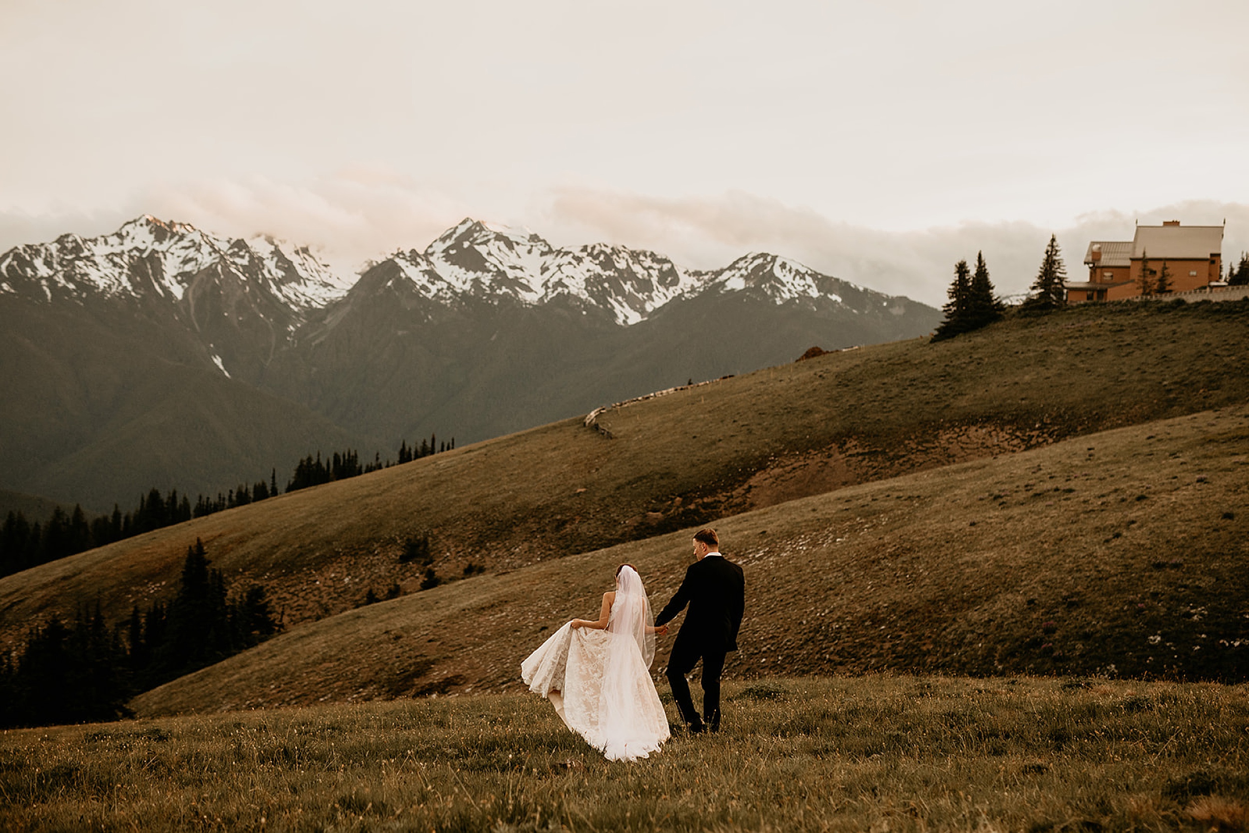 bride and groom walking mountain hill washington landscape
 